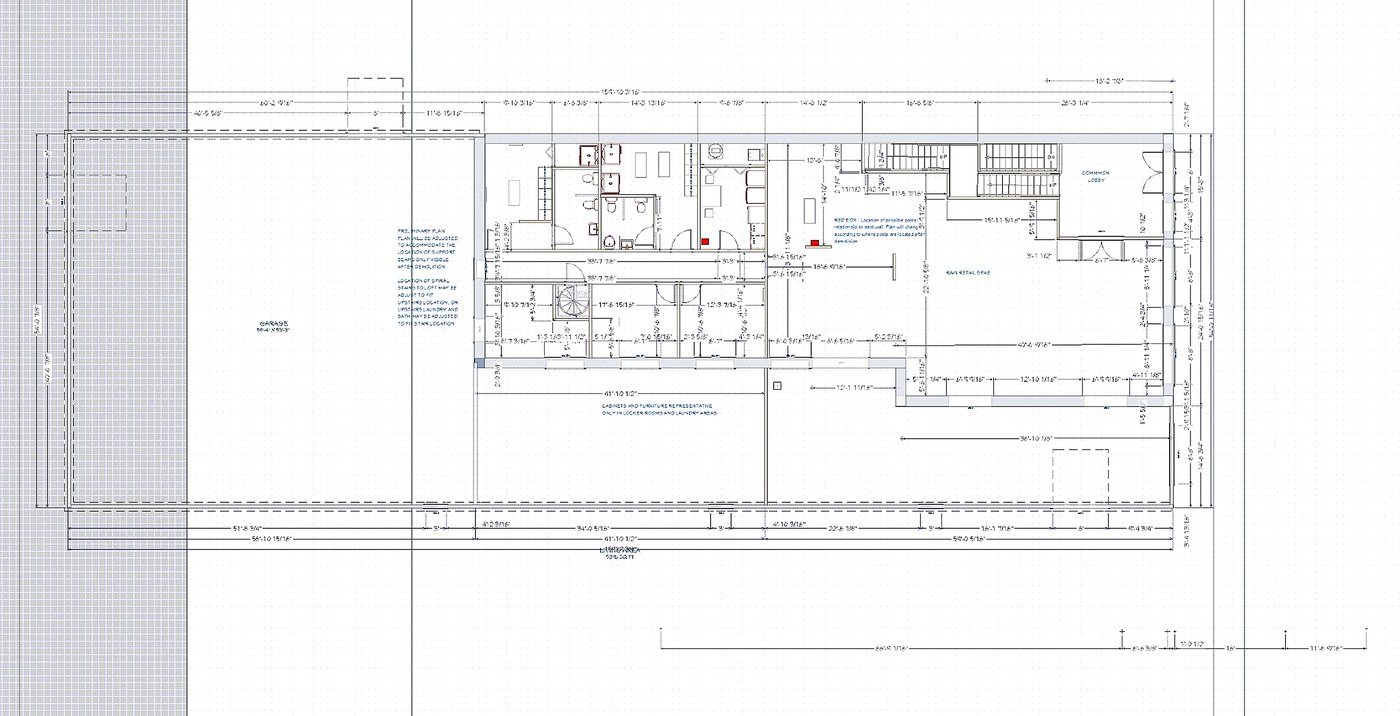 Architectural floor plan of the first floor showing the garage, main retail space, common lobby, offices, locker rooms and stairway.