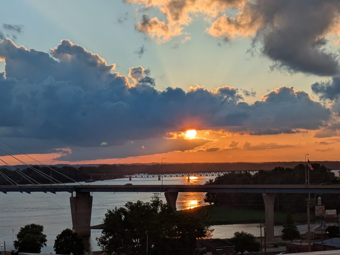 The Mississippi River at sunset from the terrace, two bridges crossing the water.